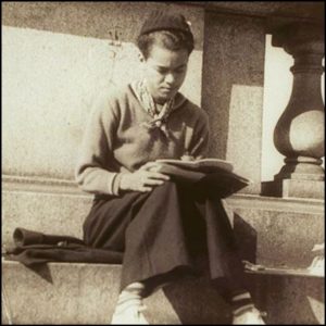 Pauli Murray Seated on Steps Writing